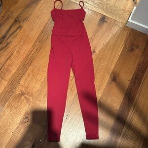 Live the process onsie with cut out in back.